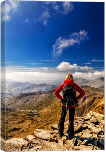 Young female hiker Hiking on mountain summit Wales Canvas Print by Spotmatik 