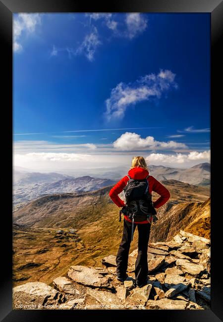 Young female hiker Hiking on mountain summit Wales Framed Print by Spotmatik 
