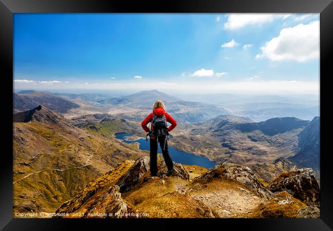 Wales young Caucasian female hiker celebrating her achievement  Framed Print by Spotmatik 