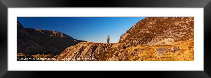 Panoramic rugged terrain of Snowdonia with female hiker Framed Mounted Print by Spotmatik 