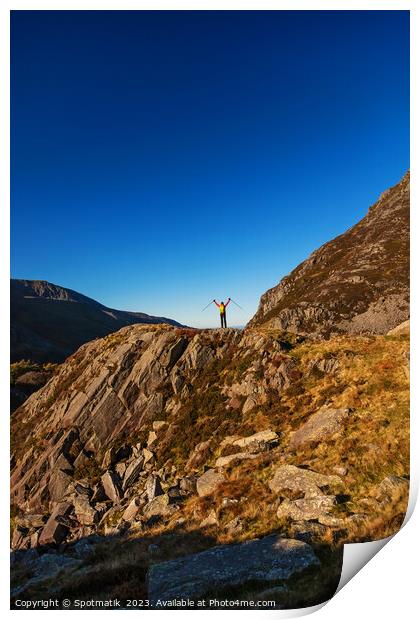 Happy female backpacker on rugged mountain peak Snowdonia Print by Spotmatik 