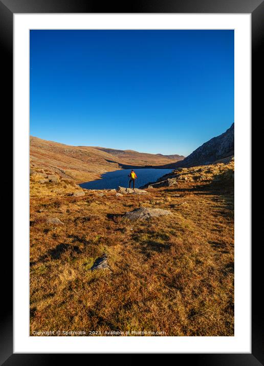 Lake in rural landscape with female backpacker Snowdonia Framed Mounted Print by Spotmatik 
