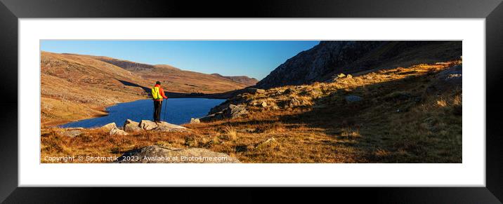 Panoramic lake Snowdonia National Park with female hiker Framed Mounted Print by Spotmatik 