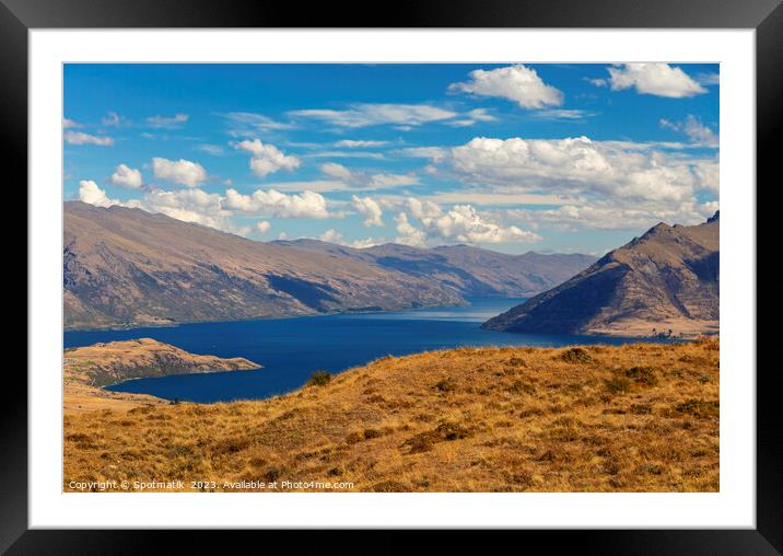Scenic views with lake in remote mountainous landscape Framed Mounted Print by Spotmatik 