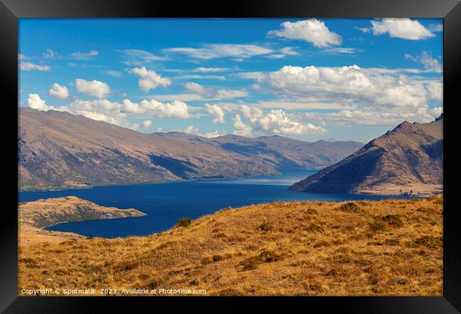 Scenic views with lake in remote mountainous landscape Framed Print by Spotmatik 