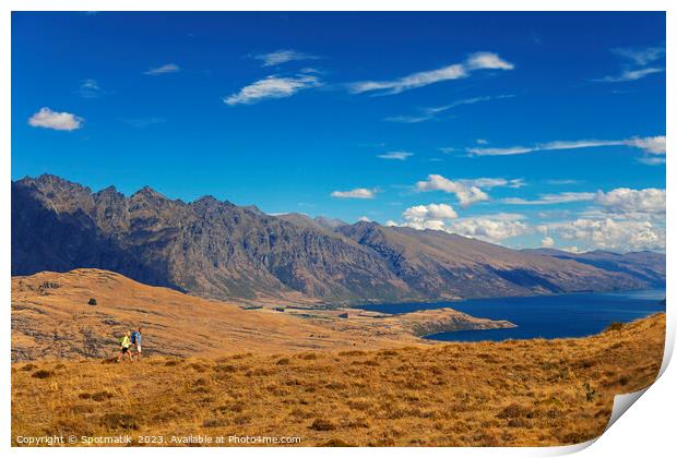 Mature backpacking couple hiking in remote mountainous landscape Print by Spotmatik 