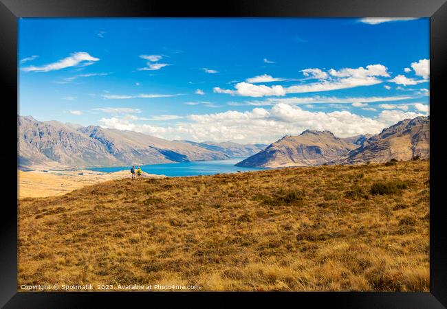 Active seniors on hiking adventure exploring New Zealand Framed Print by Spotmatik 