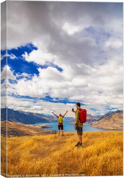 Travel Happy couple taking picture Lake Wakatipu South Island Canvas Print by Spotmatik 