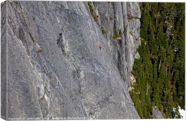 Aerial male climber rocky cliff face Squamish Canada  Canvas Print by Spotmatik 