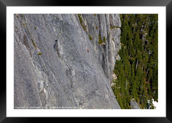 Aerial male climber rocky cliff face Squamish Canada  Framed Mounted Print by Spotmatik 