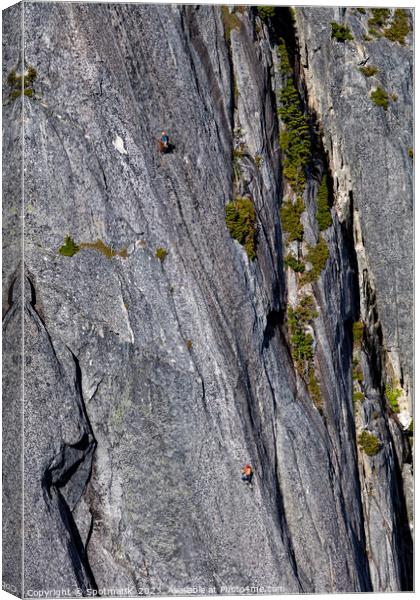 Aerial male rock climber cliff face Squamish Canada Canvas Print by Spotmatik 