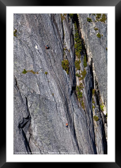 Aerial male rock climber cliff face Squamish Canada Framed Mounted Print by Spotmatik 