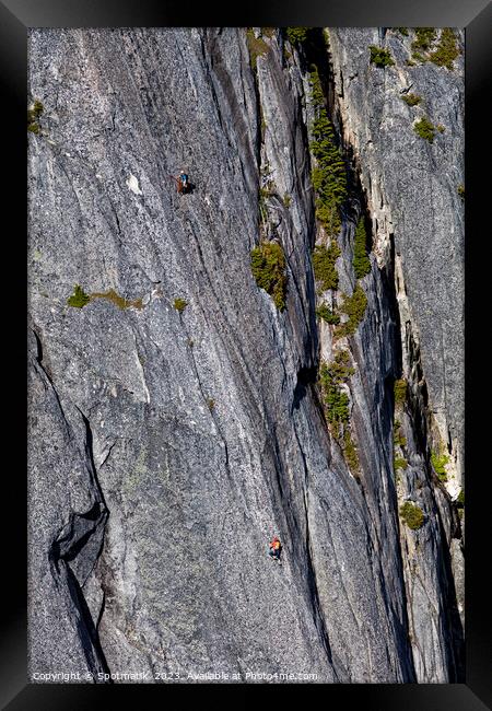 Aerial male rock climber cliff face Squamish Canada Framed Print by Spotmatik 