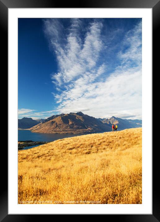 New Zealand trekking couple viewing Lake Wakatipu Otago Framed Mounted Print by Spotmatik 