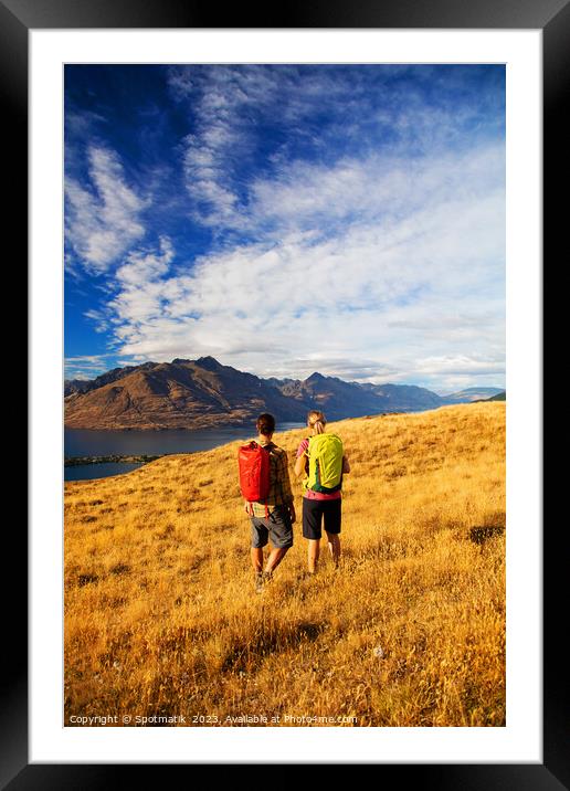 New Zealand trekking couple viewing Lake Wakatipu Otago Framed Mounted Print by Spotmatik 