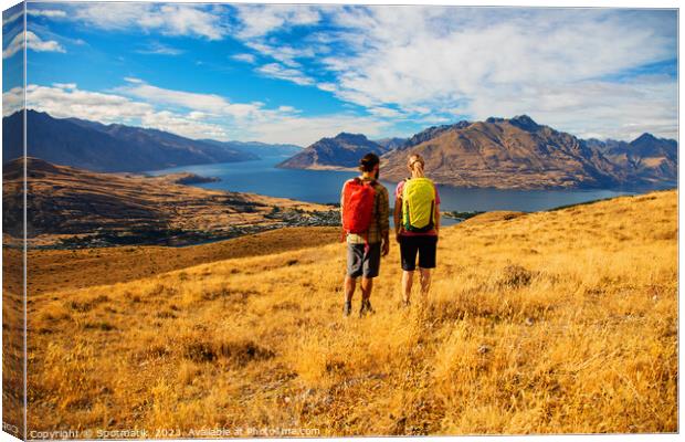 Adventure couple on vacation hiking trip South Island Canvas Print by Spotmatik 