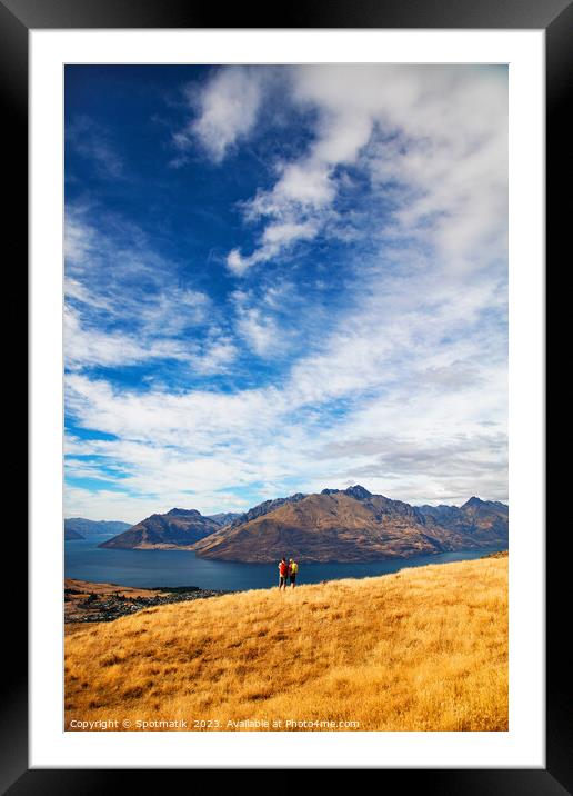 Male female hikers viewing Lake Wakatipu New Zealand  Framed Mounted Print by Spotmatik 