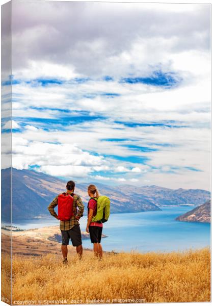New Zealand Male female hikers trekking The Remarkables Canvas Print by Spotmatik 