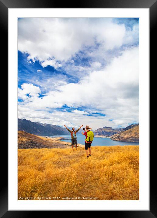 Queenstown girl taking smart phone picture New Zealand  Framed Mounted Print by Spotmatik 