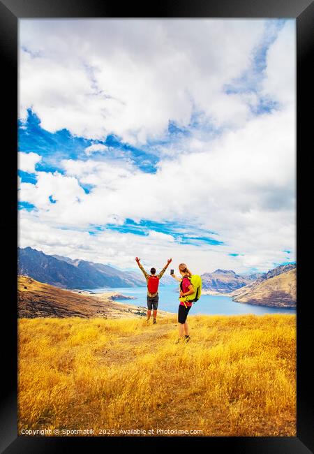 Happy female using smartphone taking travel photo friend Framed Print by Spotmatik 