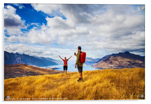 Backpacking young couple taking smartphone picture Lake Wakatipu  Acrylic by Spotmatik 