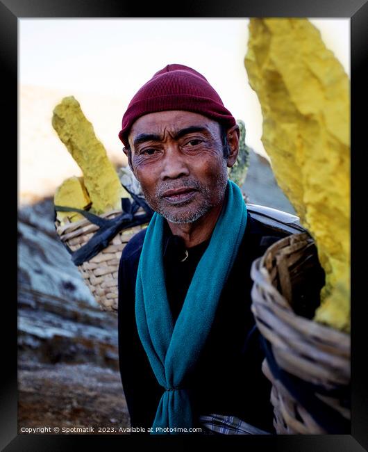 Sulphur blocks carried by male Indonesian worker Asia Framed Print by Spotmatik 