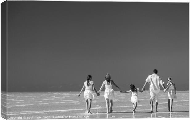 Happy travel family on tropical beach enjoying leisure Canvas Print by Spotmatik 