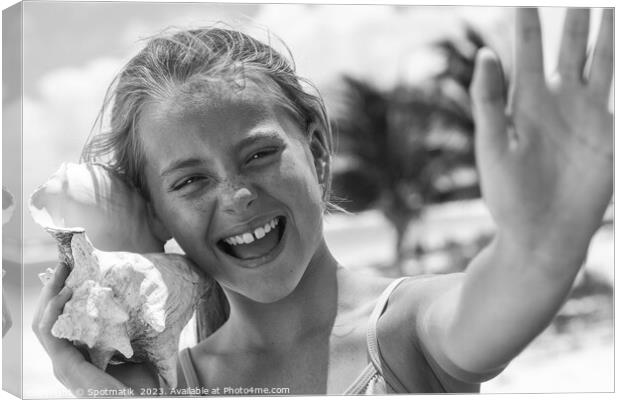 Portrait of beautiful girl with seashell on beach Canvas Print by Spotmatik 