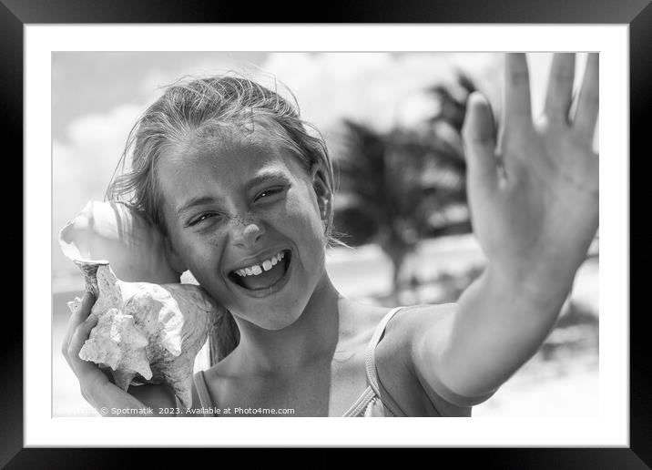 Portrait of beautiful girl with seashell on beach Framed Mounted Print by Spotmatik 