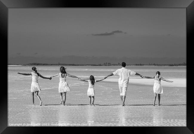 Healthy Caucasian family together on beach vacation Bahamas Framed Print by Spotmatik 