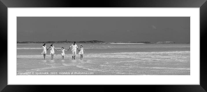 Panorama of mother father with family walking on beach  Framed Mounted Print by Spotmatik 