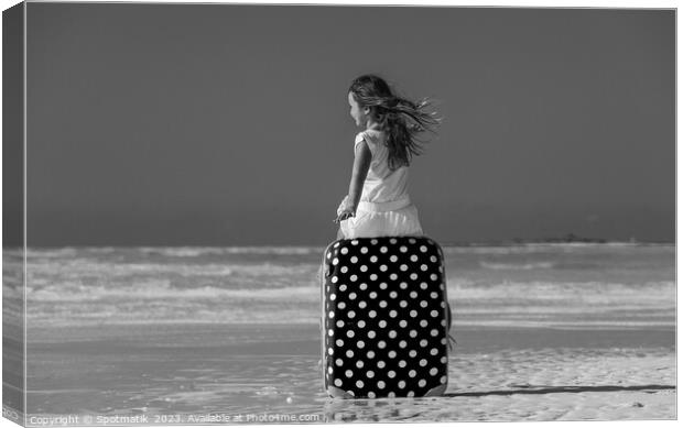 Girl sitting on red polka dot travel suitcase  Canvas Print by Spotmatik 