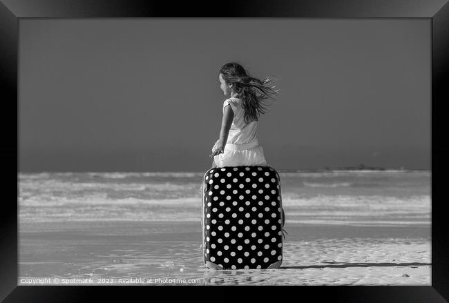 Girl sitting on red polka dot travel suitcase  Framed Print by Spotmatik 