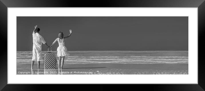 Panoramic of young couple vacationing Bahamas ocean beach Framed Mounted Print by Spotmatik 