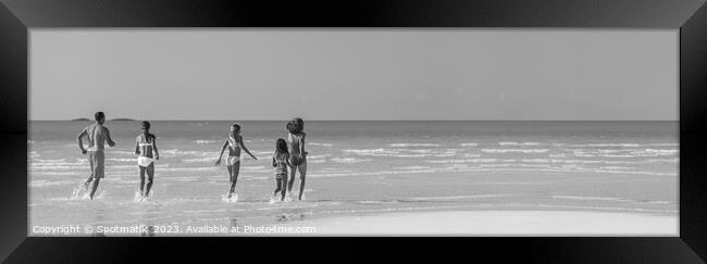 Panorama Caucasian parents and daughters Caribbean beach Framed Print by Spotmatik 