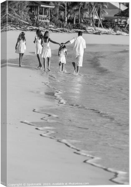 Young Caucasian girls parents on tropical island beach Canvas Print by Spotmatik 