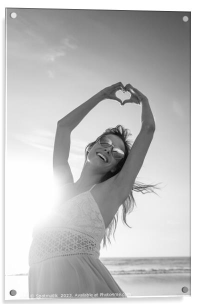 Bohemian girl dancing on beach showing heart sign Acrylic by Spotmatik 