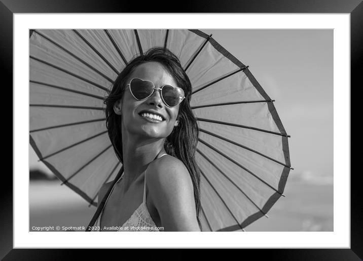 Hippy chic with parasol smiling in beach vacation Framed Mounted Print by Spotmatik 