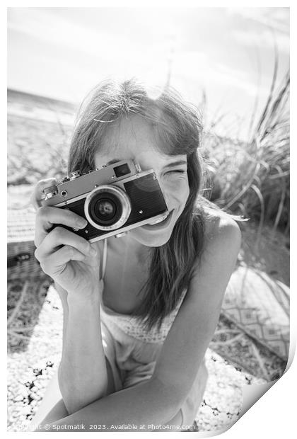 Smiling Caucasian girl with retro camera photograph beach vacation Print by Spotmatik 