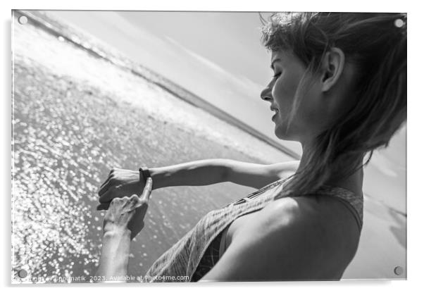 Caucasian female on ocean edge checking sports watch Acrylic by Spotmatik 