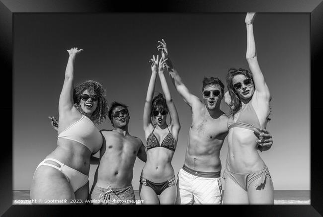 Beach party fun friends in swimwear enjoying vacation Framed Print by Spotmatik 