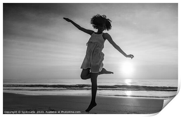 Barefoot young African American woman dancing on beach Print by Spotmatik 