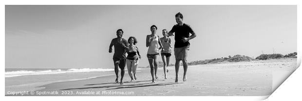 Panoramic view of friends jogging together on beach Print by Spotmatik 
