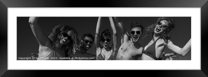 Panoramic view of friends having fun on beach Framed Mounted Print by Spotmatik 