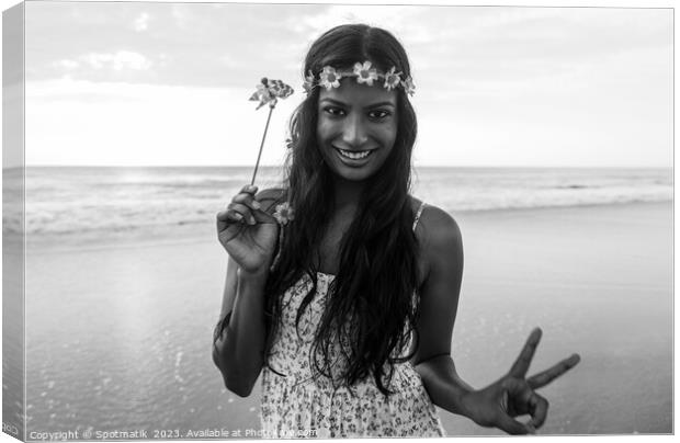 Freedom outdoors for smiling Indian girl by ocean Canvas Print by Spotmatik 