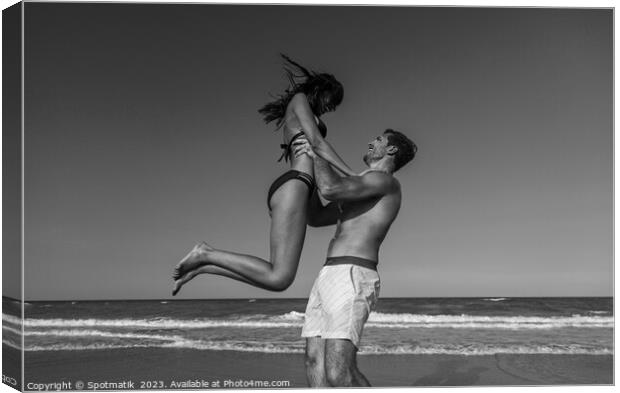 Male and female in swimwear enjoying Summer fun Canvas Print by Spotmatik 