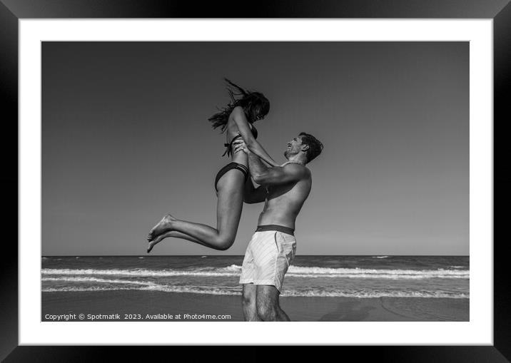 Male and female in swimwear enjoying Summer fun Framed Mounted Print by Spotmatik 