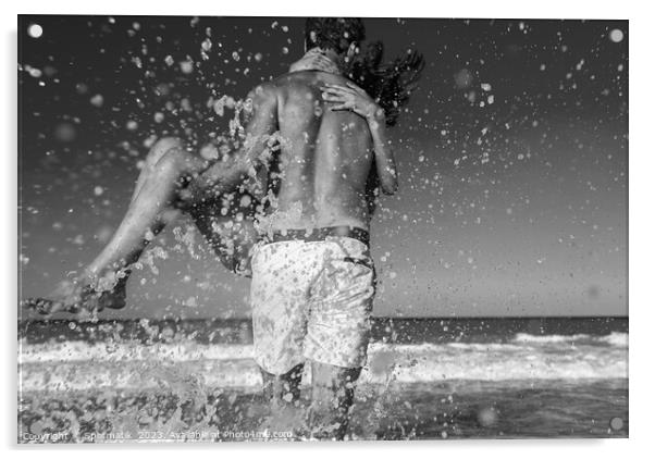 Fun loving ethnic couple running in ocean waves Acrylic by Spotmatik 