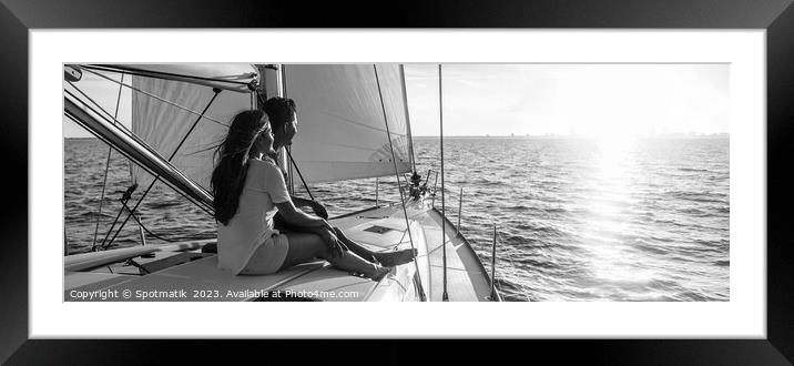 Panorama of young Hispanic couple at leisure on luxury yacht Framed Mounted Print by Spotmatik 