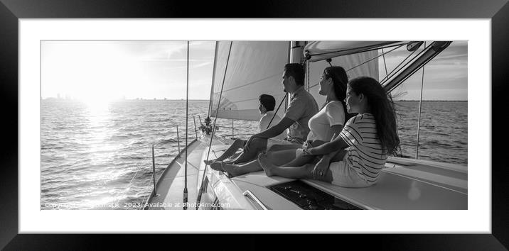 Panorama of Latin American family on sailing vacation at sunset Framed Mounted Print by Spotmatik 